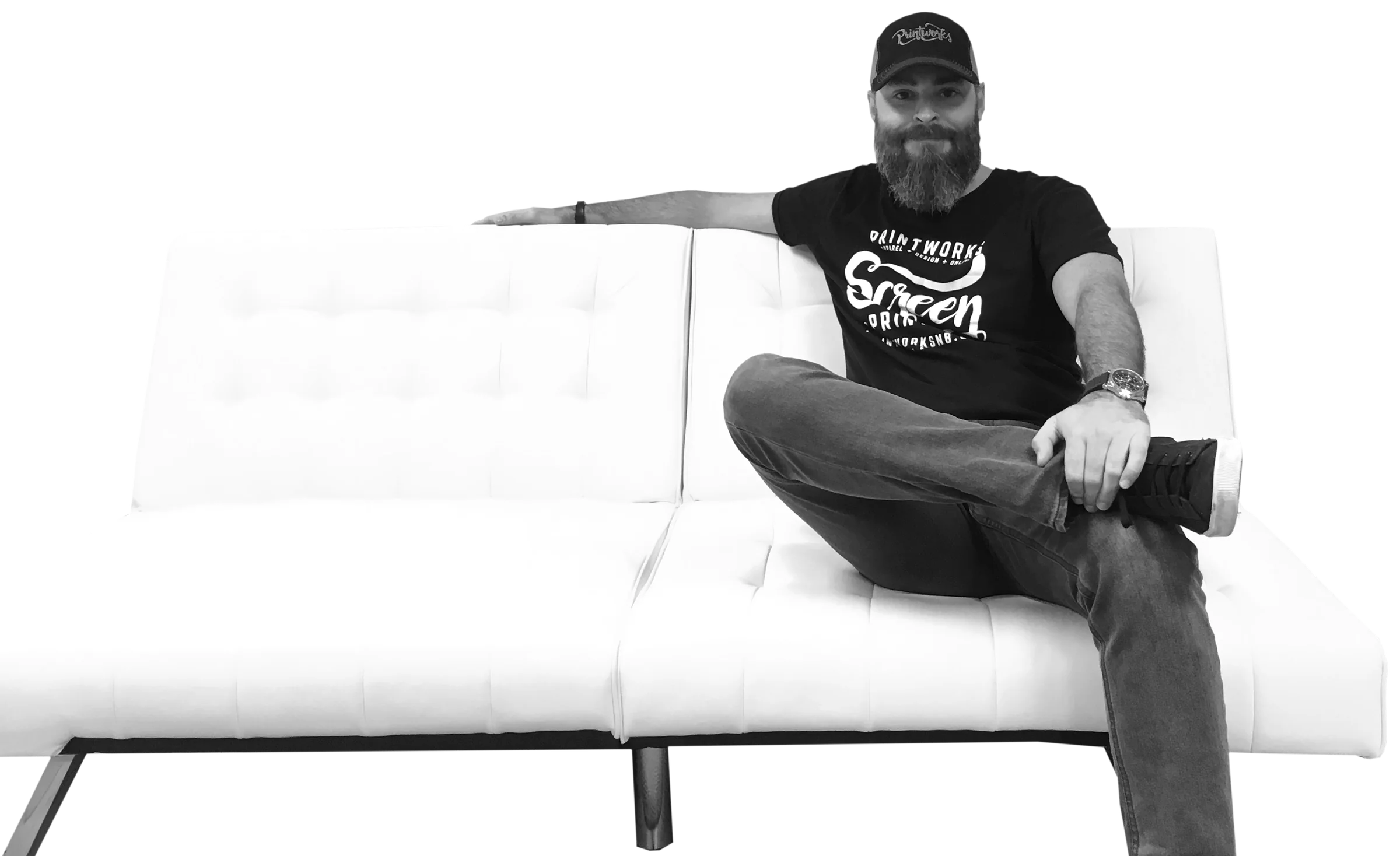 Mike Davidson sitting on a white couch